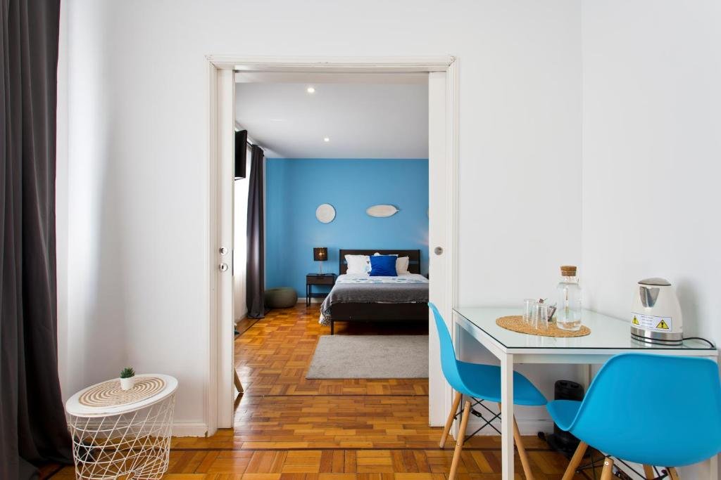 Solo Female Travel in Porto: 3 Day Slow-Travel Itinerary A minimalist cozy guest room of a bed and breakfast in Porto