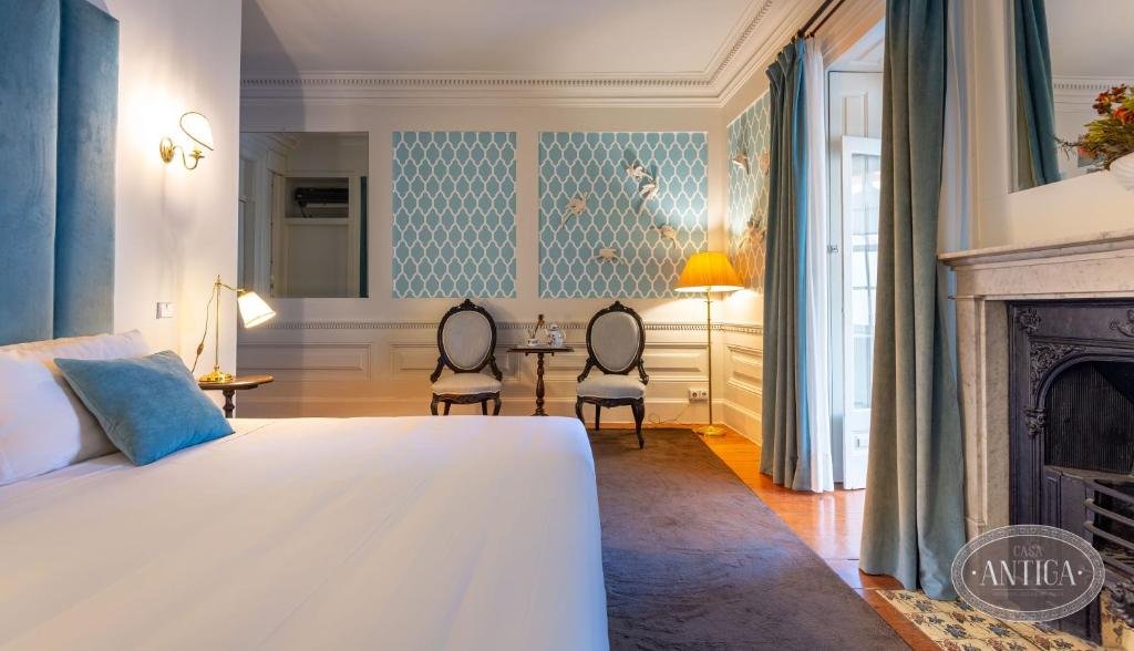 Solo Female Travel in Porto: 3 Day Slow-Travel Itinerary A room room of a renovated guesthouse with a fireplace in Porto