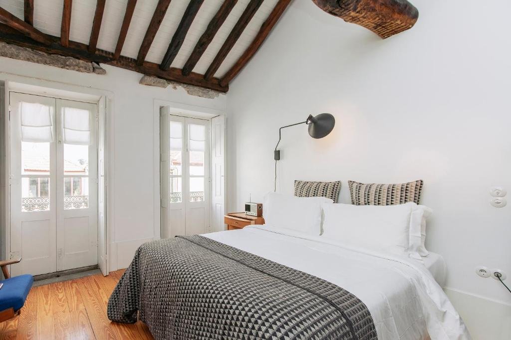 Solo Female Travel in Porto: 3 Day Slow-Travel Itinerary A traditionally restored boutique guesthouse room in Porto